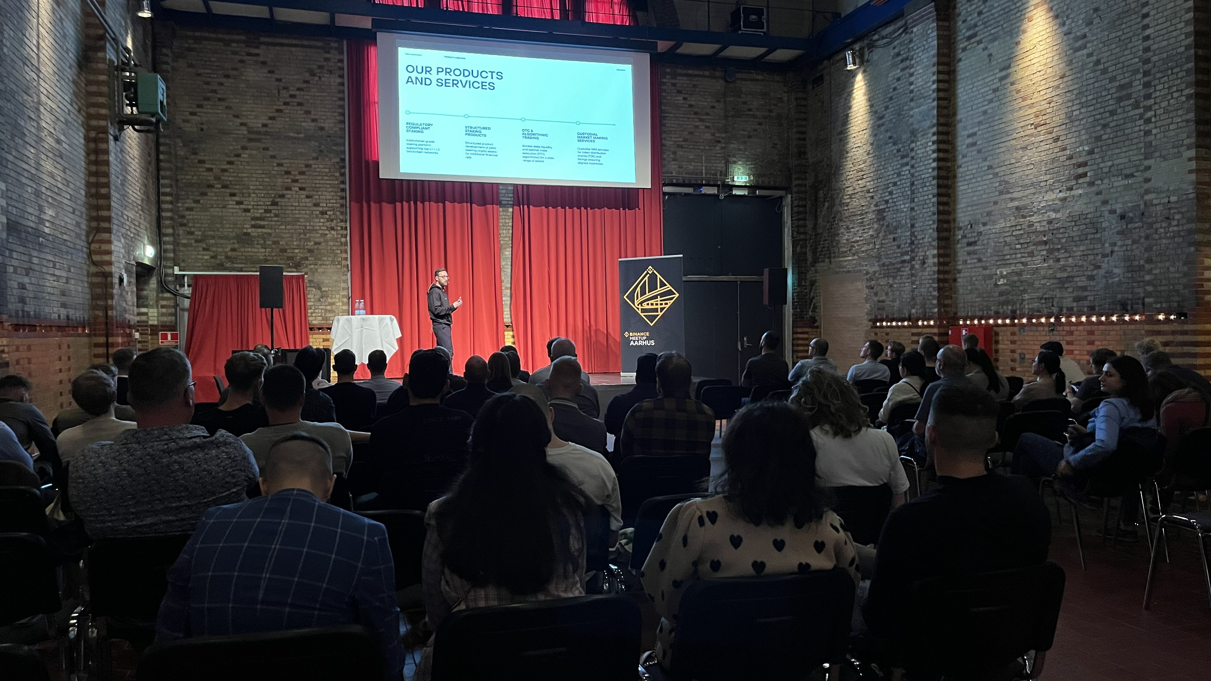 Sebastian Heine presenting on stage